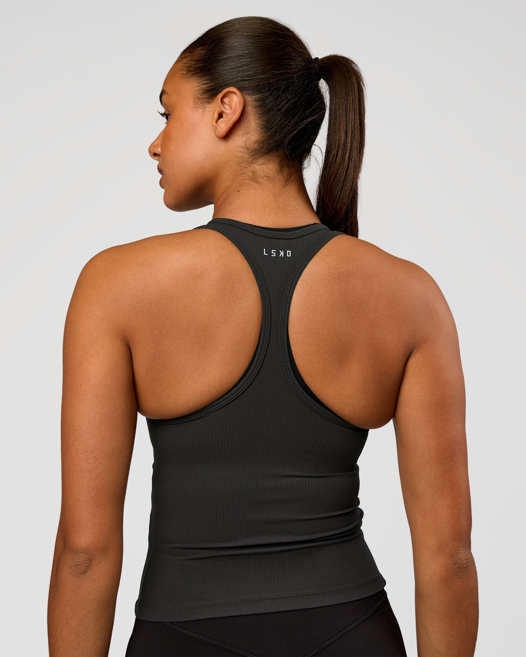 Woman wearing Flow Rib Scoop Neck Tank - Onyx | Model:Rosie | Size:S - view 2