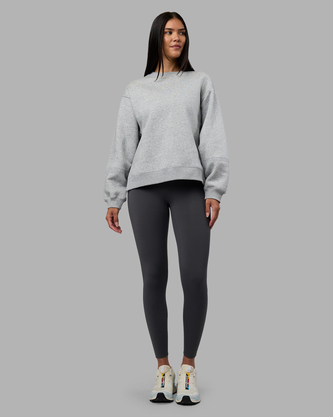 Woman wearing Full Form Fleece Sweater with Side Slits - Marl Grey | Model:Rhiley | Size:S