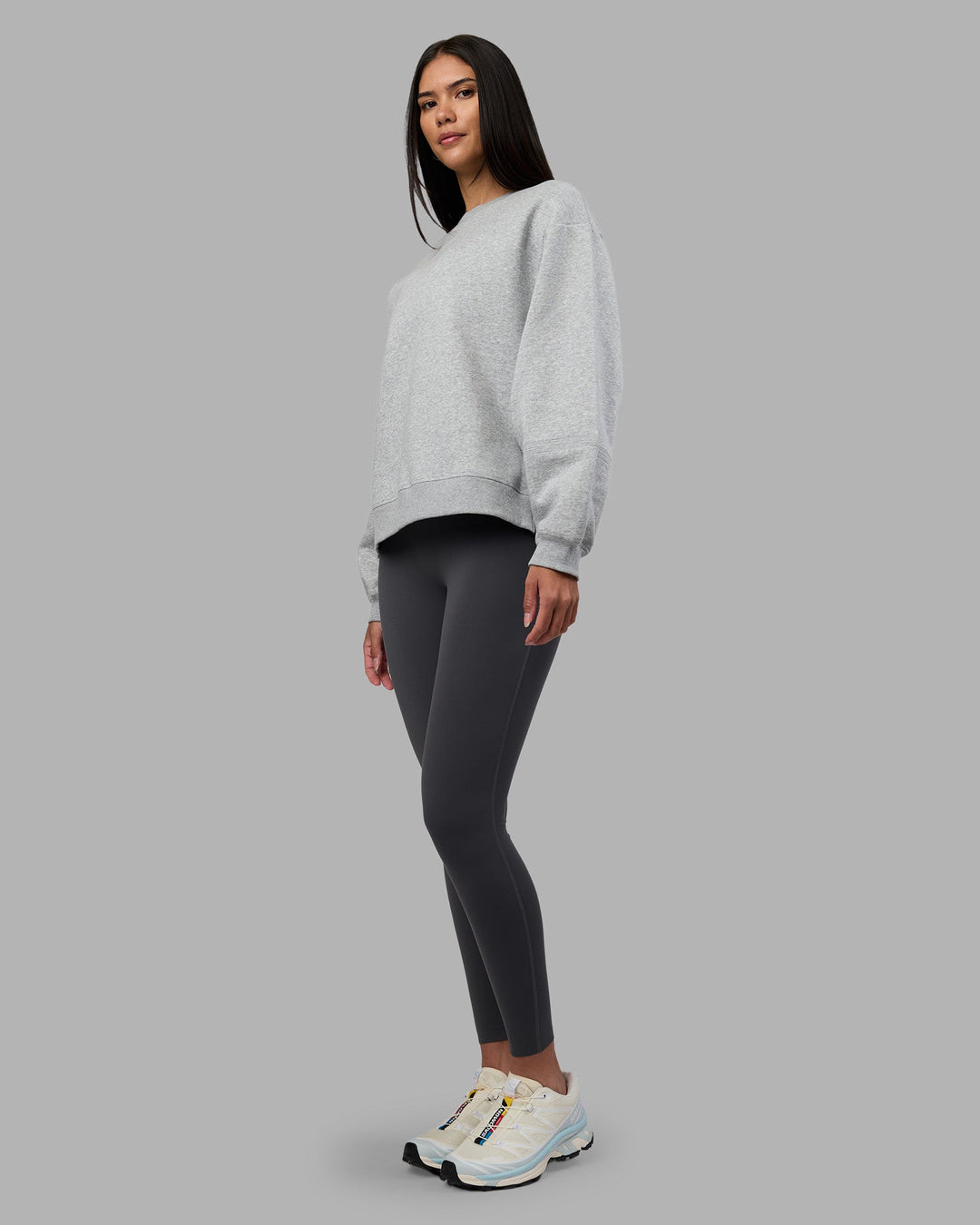 Woman wearing Full Form Fleece Sweater with Side Slits - Marl Grey | Model:Rhiley | Size:S