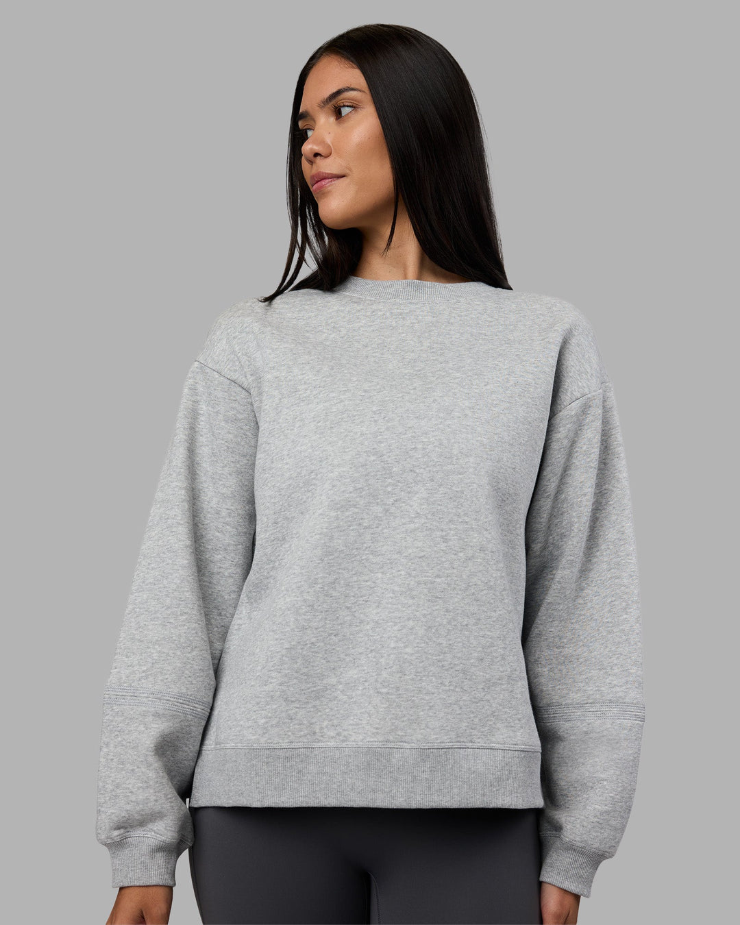 Woman wearing Full Form Fleece Sweater with Side Slits - Marl Grey | Model:Rhiley | Size:S