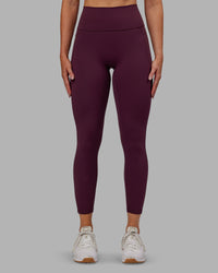 Woman wearing Fusion Ultra High-Rise 7/8 Legging Pockets - Cherry Lacquer | Model:Paris | Size:S