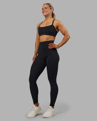 Woman wearing Fusion Ultra High-Rise Full Length Legging Pockets - Black | Model:Georgia | Size:S