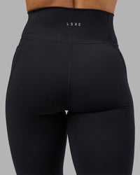 Woman wearing Fusion Ultra High-Rise Full Length Legging Pockets - Black | Model:Georgia | Size:S