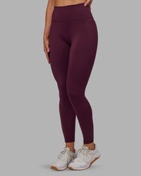 Woman wearing Fusion Ultra High-Rise Full Length Legging Pockets - Cherry Lacquer | Model:Paris | Size:S
