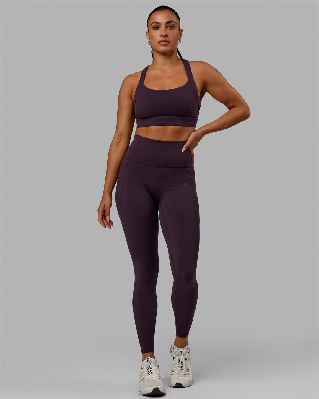 Woman wearing Fusion Ultra High-Rise Full Length Legging Pockets - Midnight Plum | Model:Gabby | Size:S