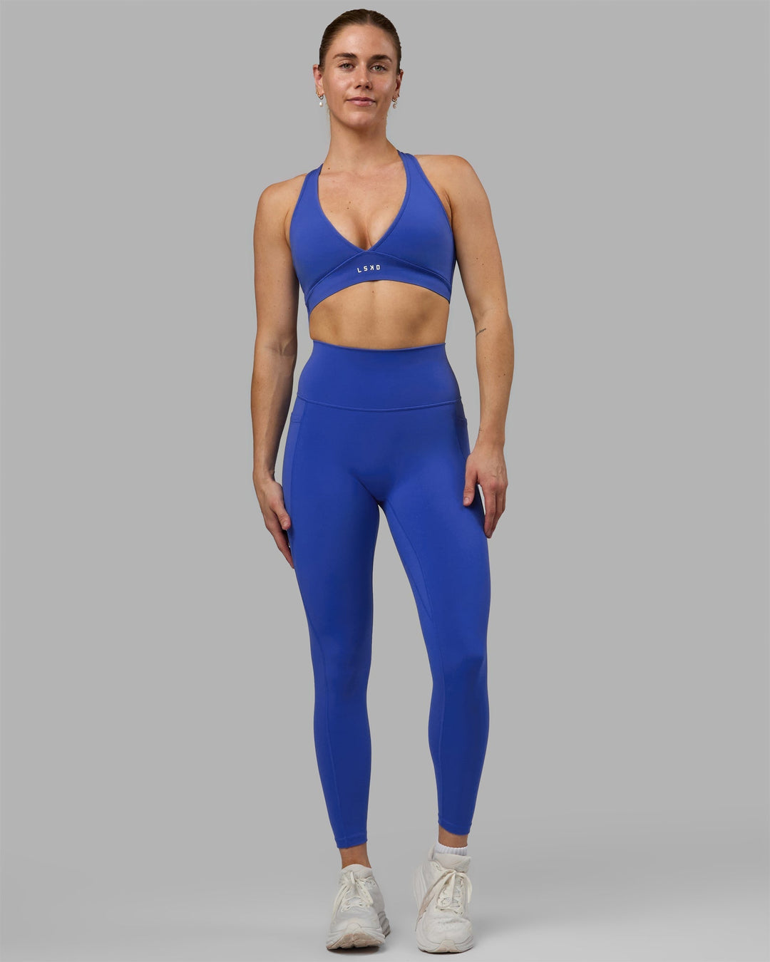 Woman wearing Fusion Ultra High-Rise Full Length Legging Pockets - Power Cobalt | Model:Remi | Size:S