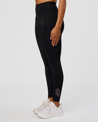 Woman wearing Fusion Graphic Ultra High-Rise Full Length Legging Pockets - Black-Radiate | Model:Rosie | Size:S