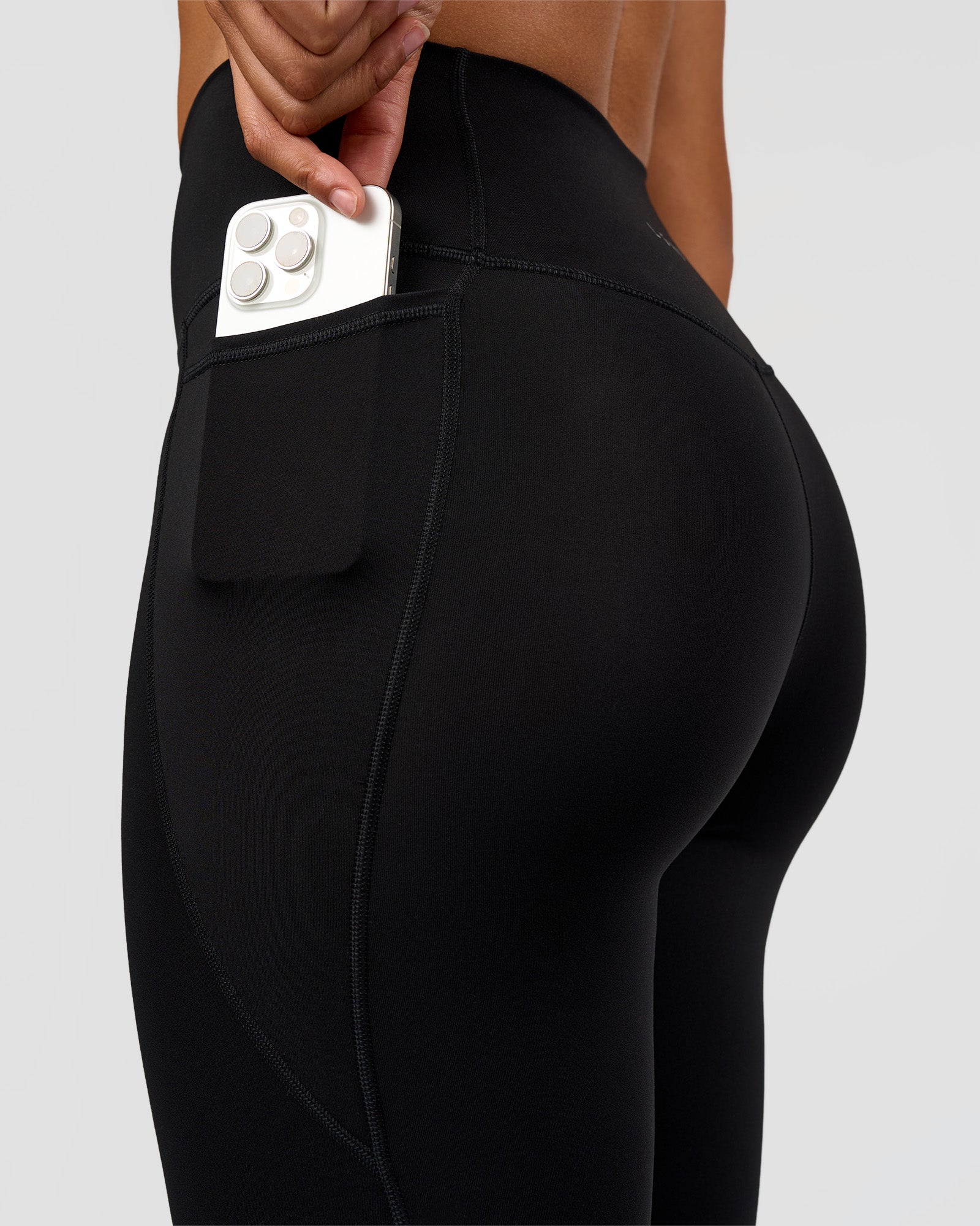 Woman wearing Fusion Graphic Ultra High-Rise Full Length Legging Pockets - Black-Radiate | Model:Rosie | Size:S