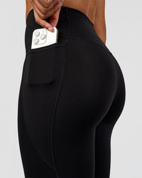 Woman wearing Fusion Graphic Ultra High-Rise Full Length Legging Pockets - Black-Radiate | Model:Rosie | Size:S