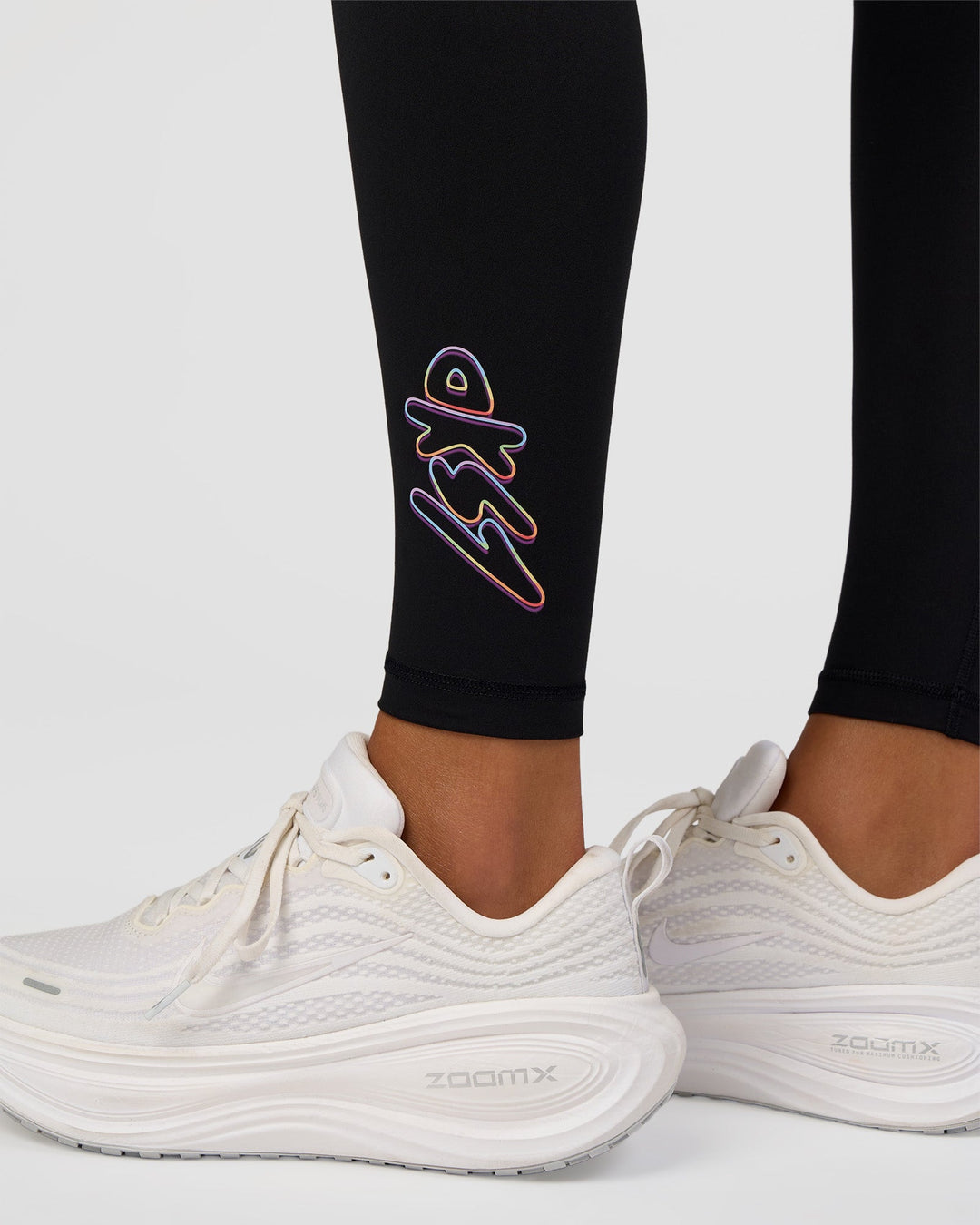 Woman wearing Fusion Graphic Ultra High-Rise Full Length Legging Pockets - Black-Radiate | Model:Rosie | Size:S