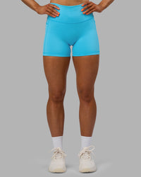 Woman wearing Fusion High-Rise 4" Short Pockets - Blue Atoll | ModelGeorgia | Size:S