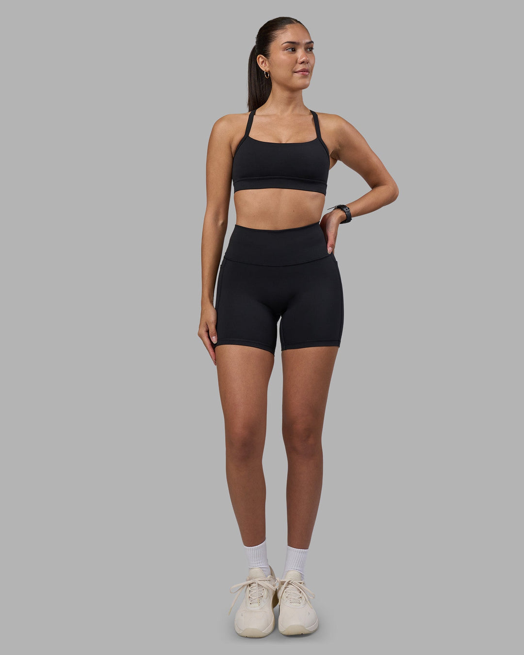 Woman wearing Fusion High-Rise 6&quot; Short Pockets - Black | Model:Rhiley | Size:S