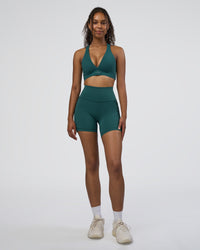 Woman wearing Fusion High-Rise 6" Short Pockets - Transformative Teal | Model:Jordan | Size:S