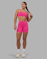 Woman wearing Fusion High-Rise 6" Short Pockets - Ultra Pink | Model:Hannah | Size:S