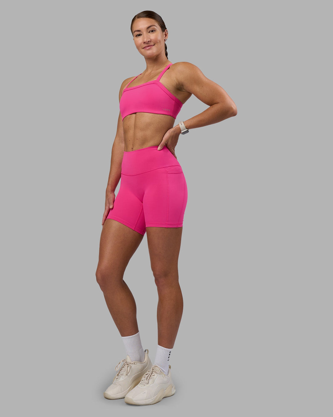 Woman wearing Fusion High-Rise 6&quot; Short Pockets - Ultra Pink | Model:Hannah | Size:S