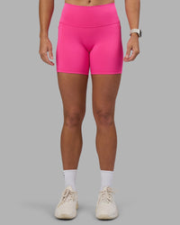Woman wearing Fusion High-Rise 6" Short Pockets - Ultra Pink | Model:Hannah | Size:S