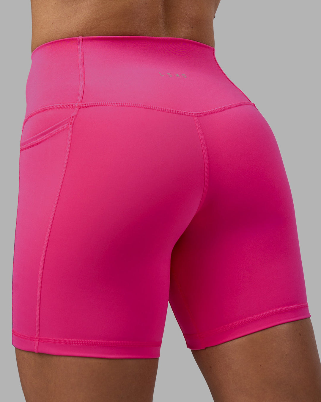Woman wearing Fusion High-Rise 6&quot; Short Pockets - Ultra Pink | Model:Hannah | Size:S