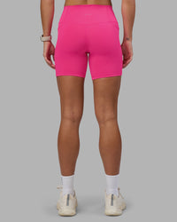 Woman wearing Fusion High-Rise 6" Short Pockets - Ultra Pink | Model:Hannah | Size:S