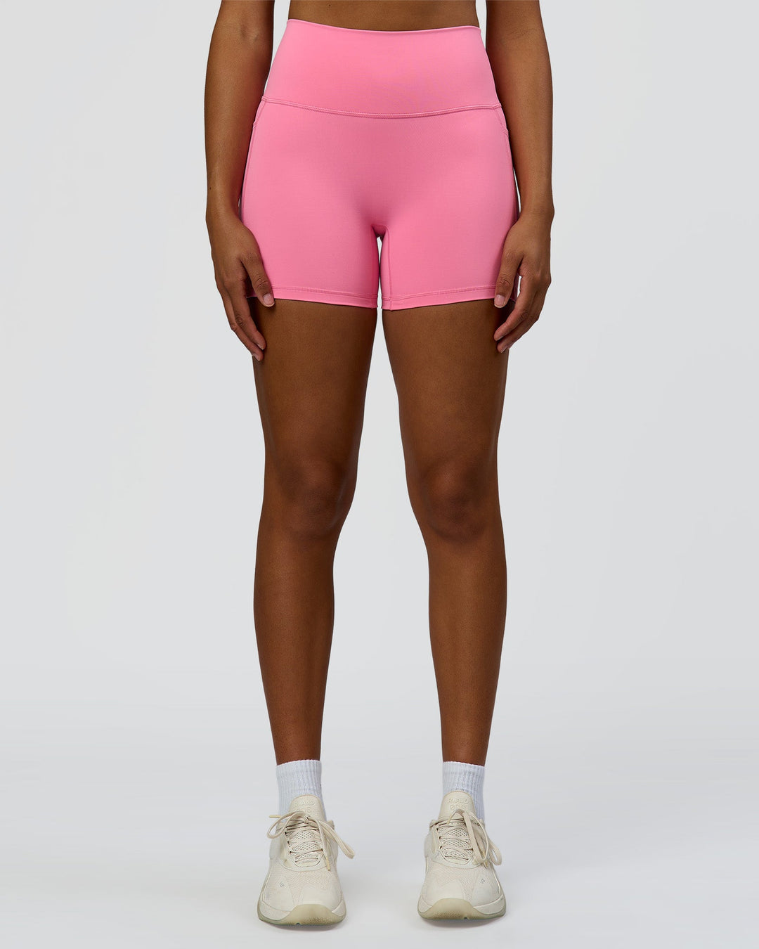 Woman wearing Fusion High-Rise 4" Short Pockets - Candy Pink | Model:Rosie | Size:S