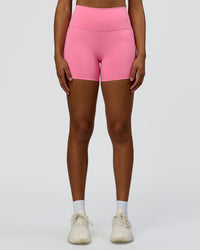 Woman wearing Fusion High-Rise 4" Short Pockets - Candy Pink | Model:Rosie | Size:S