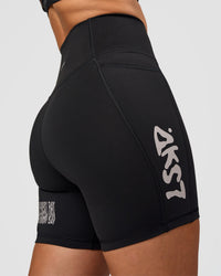 Woman wearing Fusion Hype Graphic Ultra High-Rise 6" Short Pockets - Black-Alloy | Model:Rhiley | Size:S