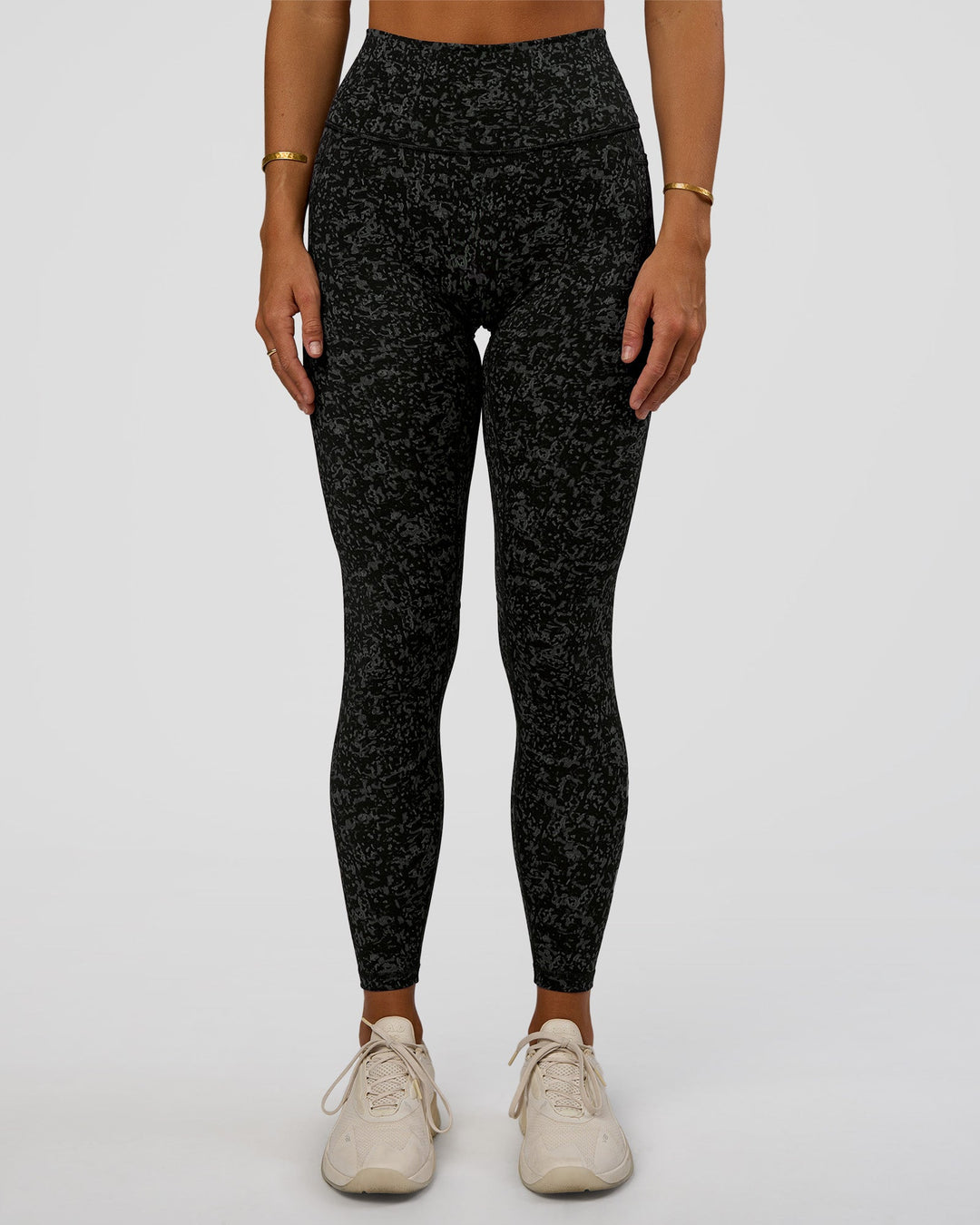 Woman wearing Fusion Icon Ultra High-Rise Full Length Legging Pockets - Energy Print Black-Reflective | Model:Amity | Size:S