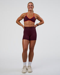 Woman wearing Fusion Jacquard High-Rise 4” Short Pockets - Cherry Lacquer | Model:Sav | Size:S