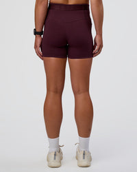 Woman wearing Fusion Jacquard High-Rise 4” Short Pockets - Cherry Lacquer | Model:Sav | Size:S