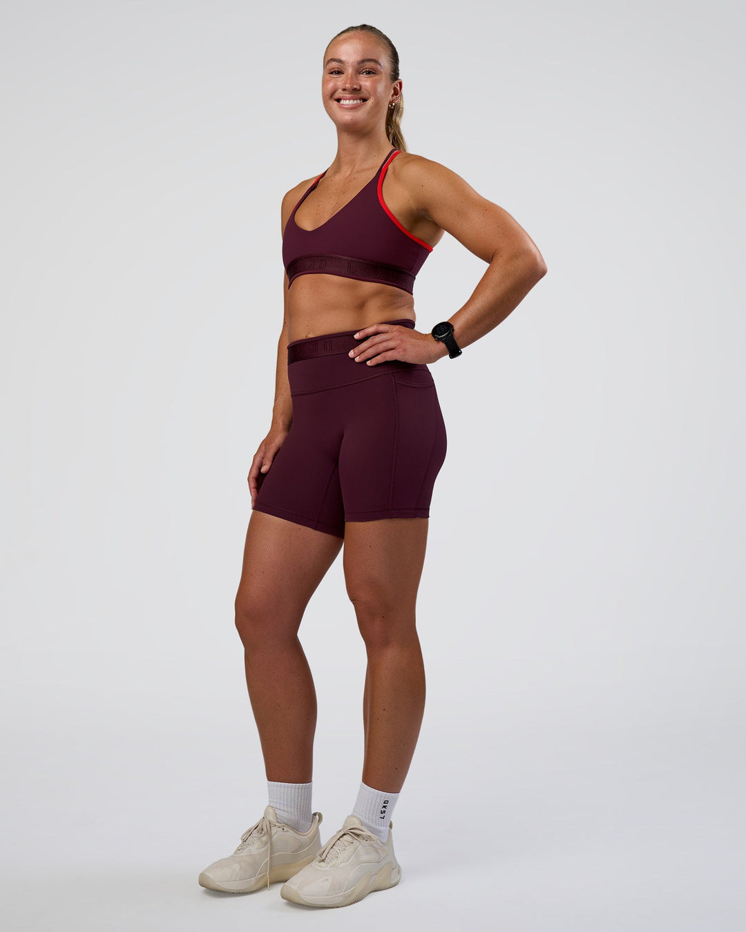 Woman wearing Fusion Jacquard High-Rise 6&quot; Short Pockets - Cherry Lacquer | Model:Sav | Size:S