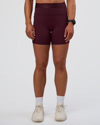 Woman wearing Fusion Jacquard High-Rise 6" Short Pockets - Cherry Lacquer | Model:Sav | Size:S