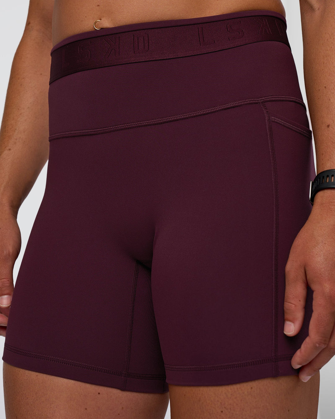 Woman wearing Fusion Jacquard High-Rise 6&quot; Short Pockets - Cherry Lacquer | Model:Sav | Size:S