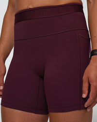 Woman wearing Fusion Jacquard High-Rise 6" Short Pockets - Cherry Lacquer | Model:Sav | Size:S