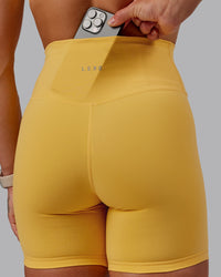 Woman wearing Fusion Ultra High-Rise 6" Short - Banana Cream | Model:Amber | Size:S