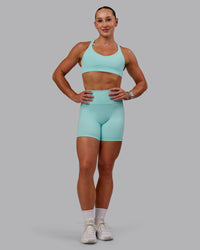 Woman wearing Fusion Ultra High-Rise 6" Short - Island Paradise | Model:Amber | Size:S