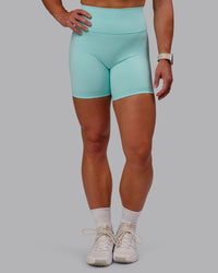 Woman wearing Fusion Ultra High-Rise 6" Short - Island Paradise | Set:true | Angle:front | Model:Amber | Size:S