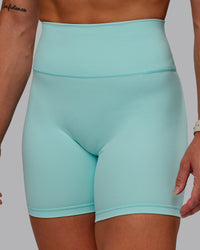 Woman wearing Fusion Ultra High-Rise 6" Short - Island Paradise | Set:true | Angle:closeup | Model:Amber | Size:S