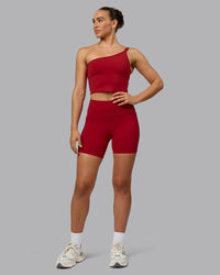 Woman wearing Fusion Ultra High-Rise 6" Short Pockets - Cherry Red | Model:Sophie | Size:S