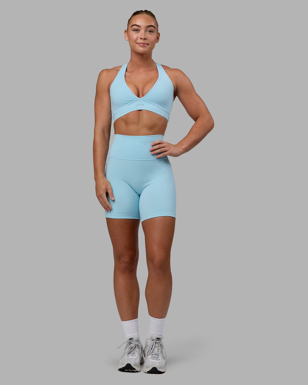 Woman wearing Fusion Mid Short Tights - Glacial Blue