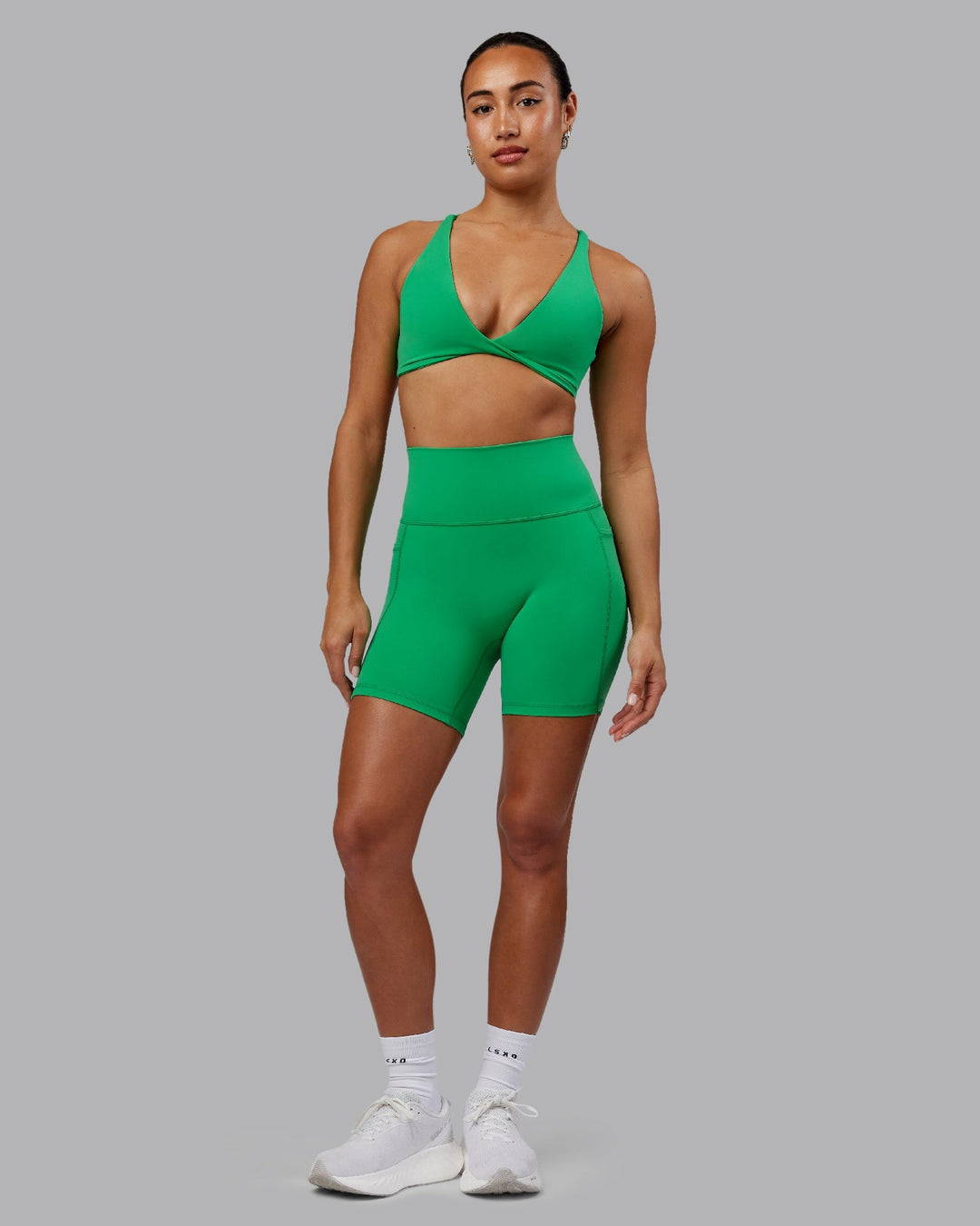 Woman wearing Fusion Mid-Length Shorts - Impact Green