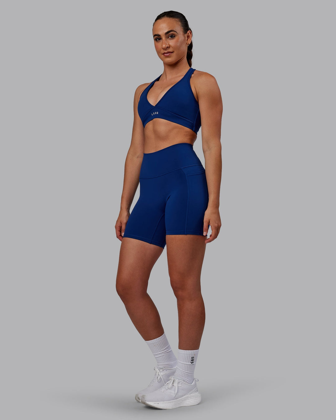 Woman wearing Fusion Mid-Length Shorts - Midnight Blue