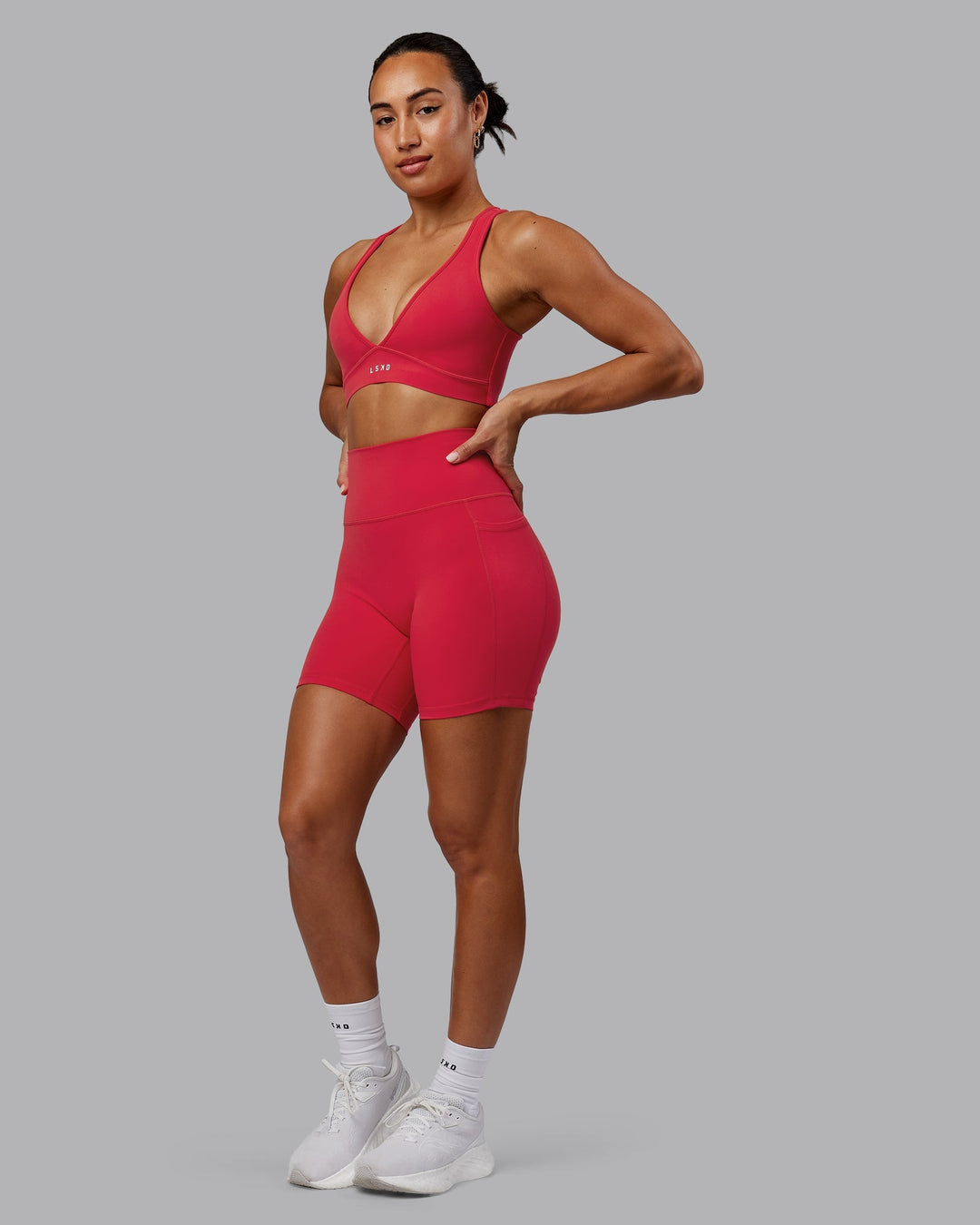 Woman wearing Fusion Mid-Length Shorts - Scarlet