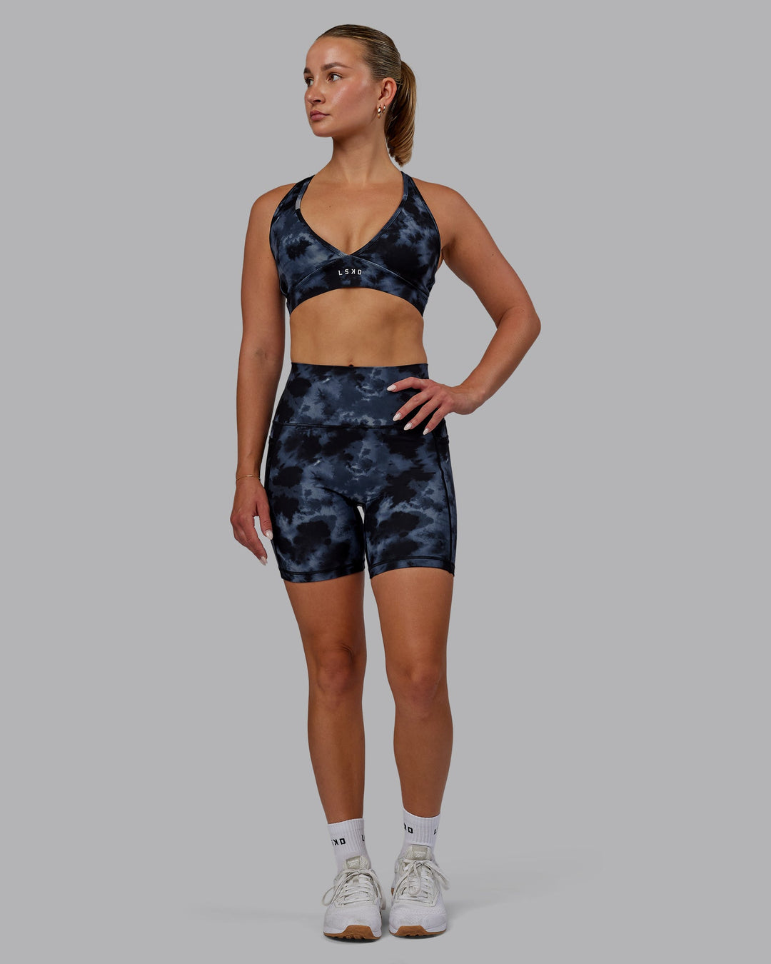 Woman wearing Fusion Mid-Length Shorts - Tie Dye-Midnight