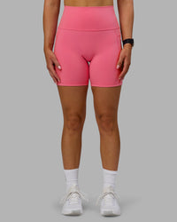 Woman wearing Fusion Ultra High-Rise 6" Short Pockets - Pink Lemonade | Set:true | Angle:front | Model:Halle | Size:S