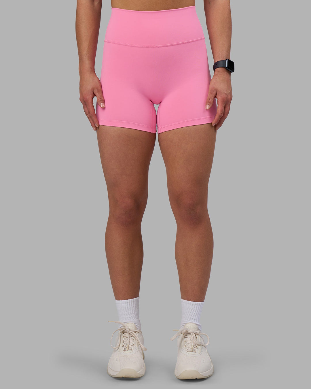 Woman wearing Fusion Ultra High-Rise 4" Short - Candy Pink | Set:true | Angle:front | Model:Keisha | Size:S