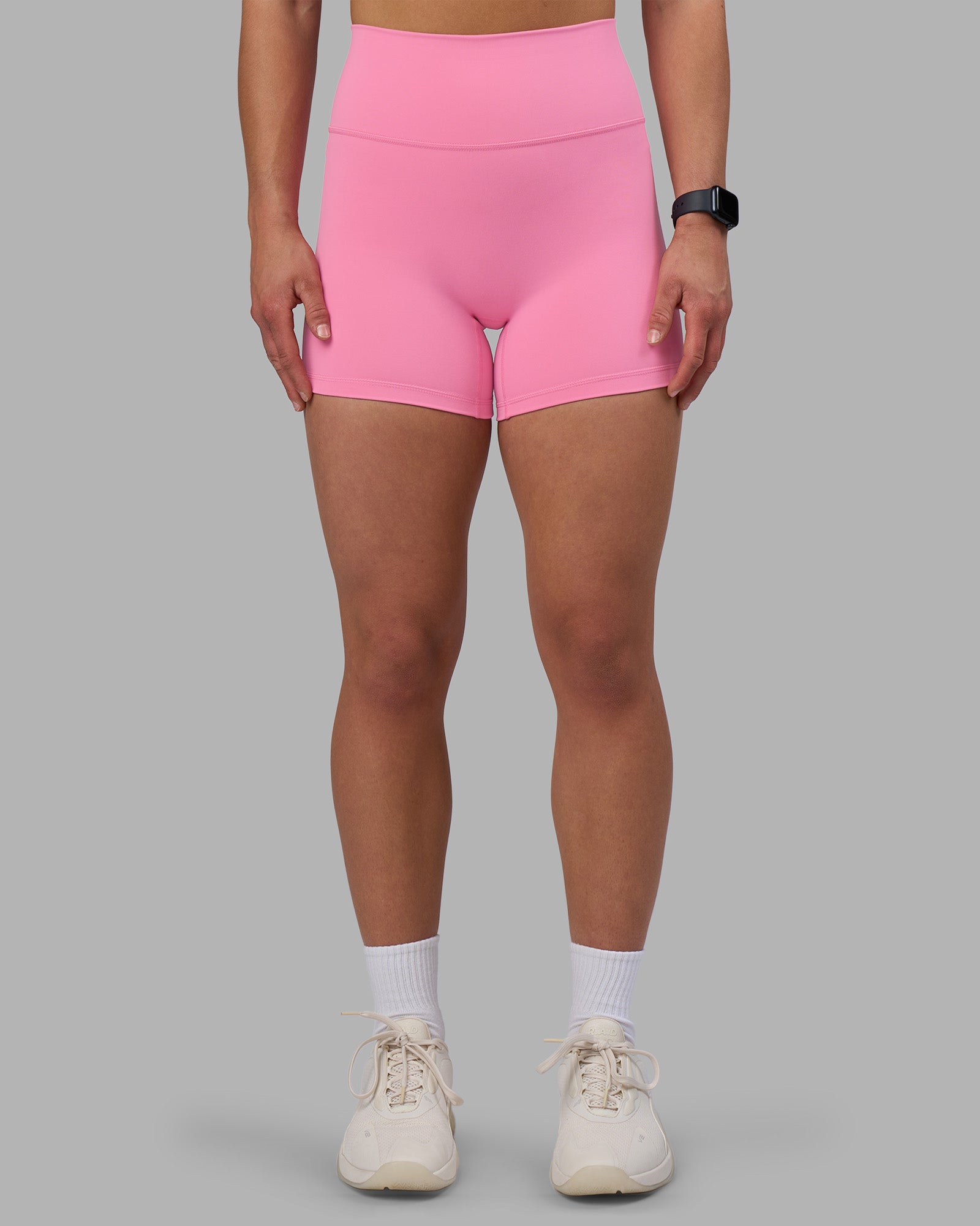 Woman wearing Fusion Ultra High-Rise 4" Short - Candy Pink | Set:true | Angle:front | Model:Keisha | Size:S