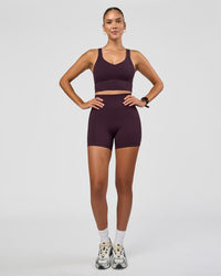 Woman wearing Fusion Ultra High-Rise 4" Short - Midnight Plum | Model:Rhiley | Size:S