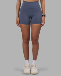 Woman wearing Fusion Ultra High-Rise 4" Short - Night Shadow | Set:true | Angle:front | Model:Rhiley | Size:S