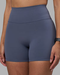 Woman wearing Fusion Ultra High-Rise 4" Short - Night Shadow | Set:true | Angle:closeup | Model:Rhiley | Size:S