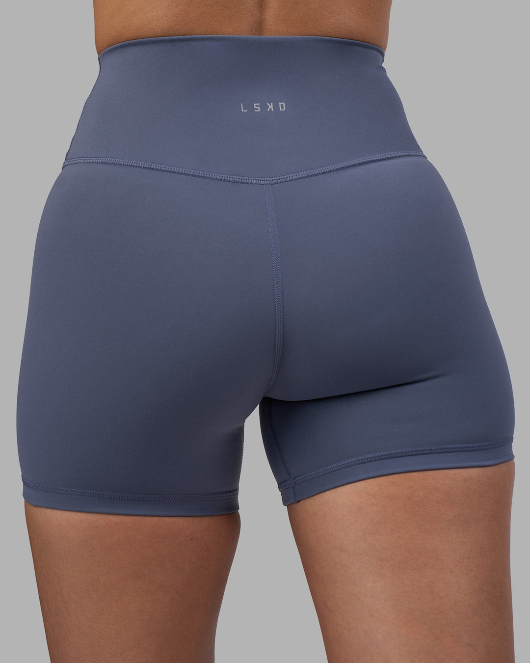 Woman wearing Fusion Ultra High-Rise 4&quot; Short - Night Shadow | Model:Rhiley | Size:S