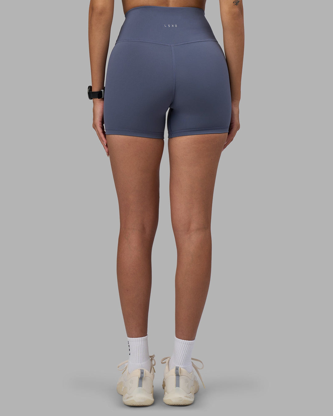 Woman wearing Fusion Ultra High-Rise 4&quot; Short - Night Shadow | Model:Rhiley | Size:S